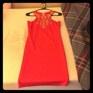 Red bodycon dress with studded design.